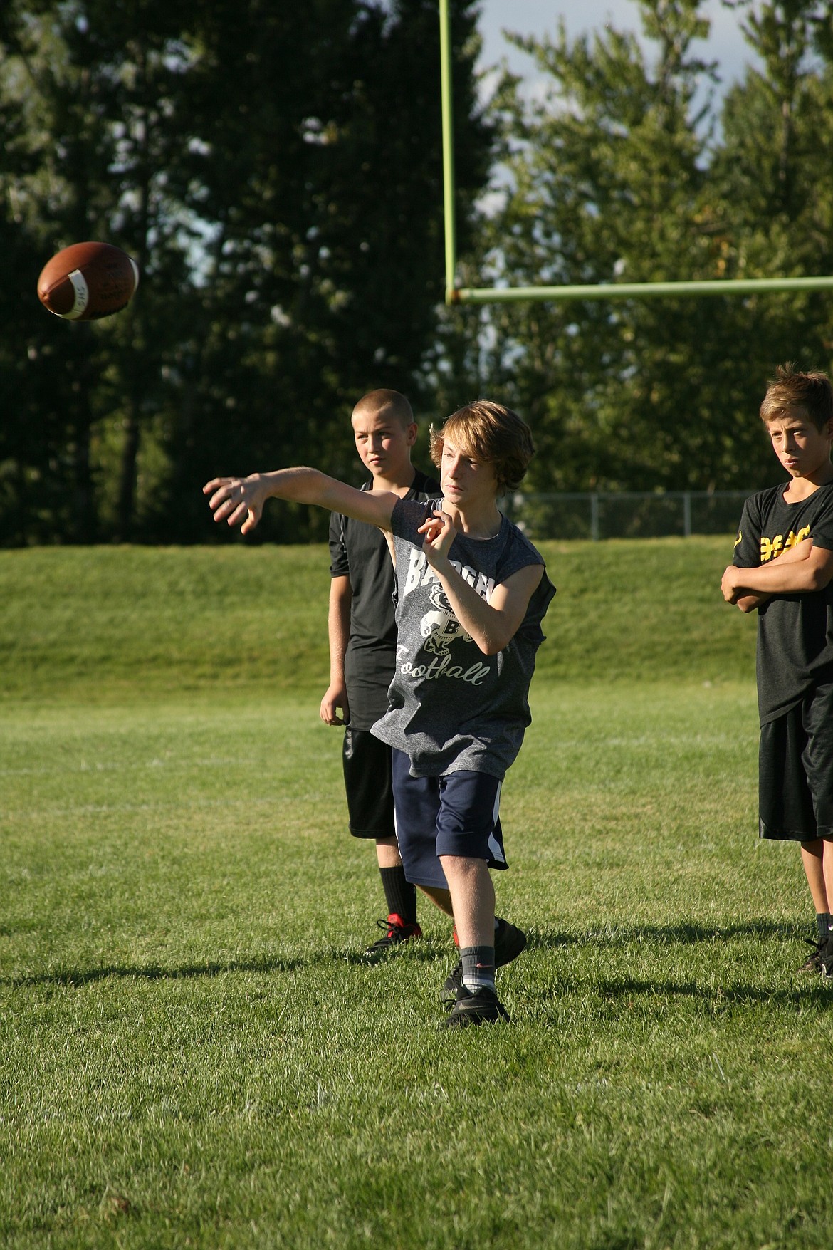 -- Photo by ERIC PLUMMER

Bonners Ferry&#146;s Dylan Hines fires a pass during day two of the free Grid Kids football camp on Thursday at sun-soaked Sandpoint High School. Led by new varsity football head coach George Yarno, the Bulldog coaches, along with some varsity players and area youth coaches, put more than 90 kids through a host of offensive drills. Area third- through eighth-graders got a fun taste of football while learning the basics of the game.