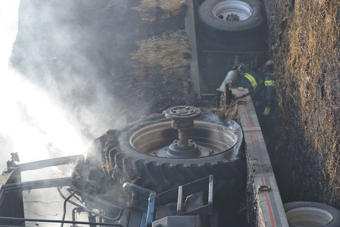 -- Photo by SARAH JENKINS

Crews investigating the scene of Tuesday's fire.