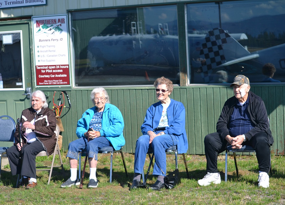 -- Photo by SARAH JENKINS

Restorium residents enjoy the sunshine as they wait for their flights.