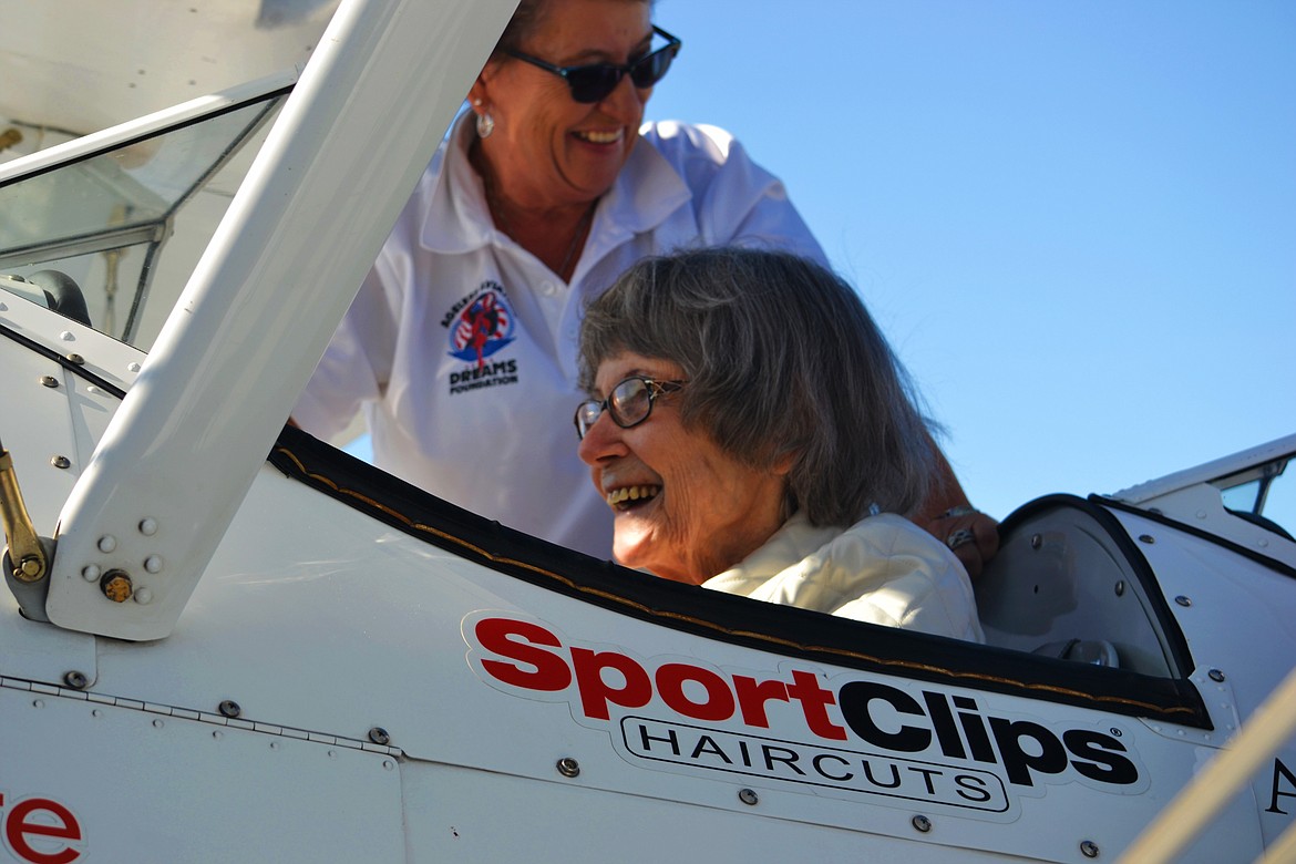 -- Photo by SARAH JENKINS

LaVeda Linnemeyer is all smiles as she is prepped for flight. See Seniors soar over Boundary County skies in a World War II Era Biplane, A-2.