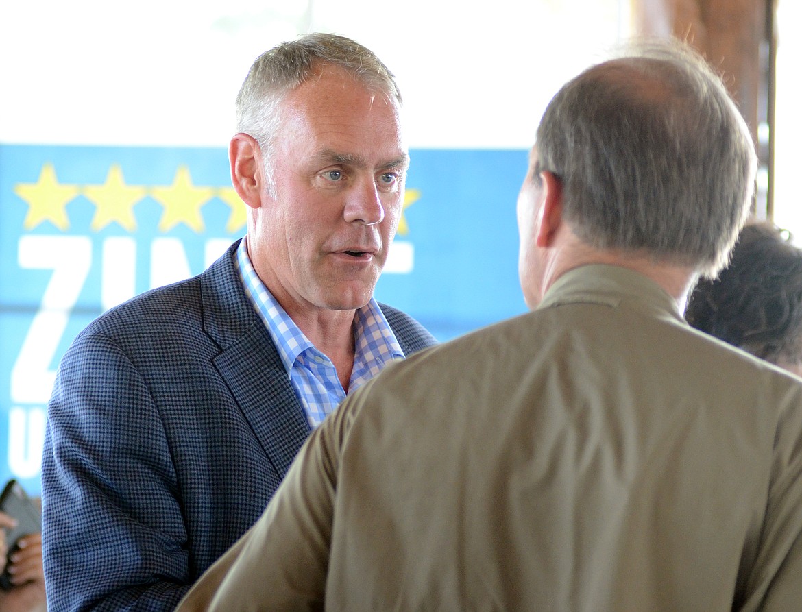 Rep. Ryan Zinke, R-Montana, speaks to an audience member prior to a campign event Tuesday at Majestic Valley Arena. Zinke was joined by Rep. Trey Gowdy, R-South Carolina, during the rally.