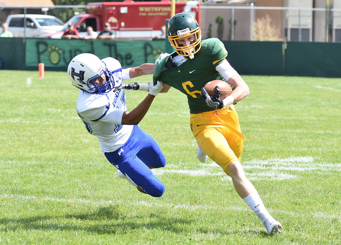 Daniel McKay photos / Whitefish Pilot
Whitefish senior Tyler Cote breaks a tackle Saturday in a nonconference game against Havre at Memorial Field.