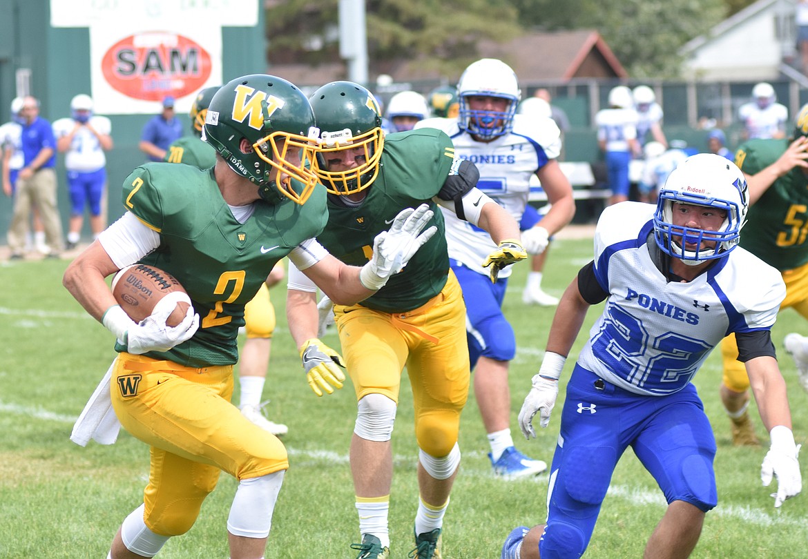 Bulldog senior Brady Staves carries the ball Saturday in a nonconference game against Havre at Whitefish.