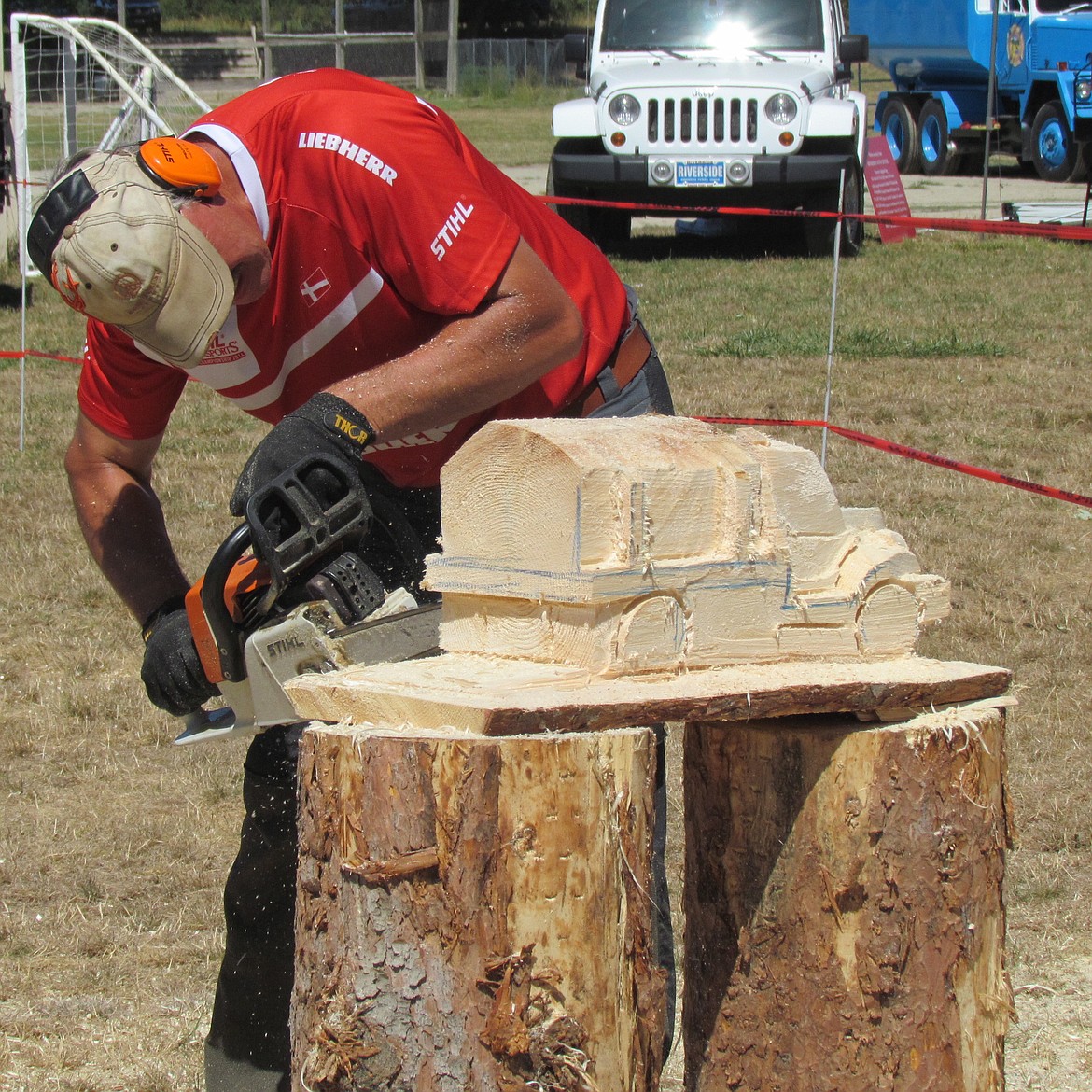 -- Photo by LYNNE HALEY

A chainsaw artist demonstrates his skills at the Idaho Forest Group Lumberjack Show.