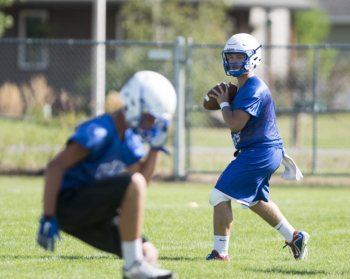 Quarterback Dakota Bridwell runs through drill on Monday.