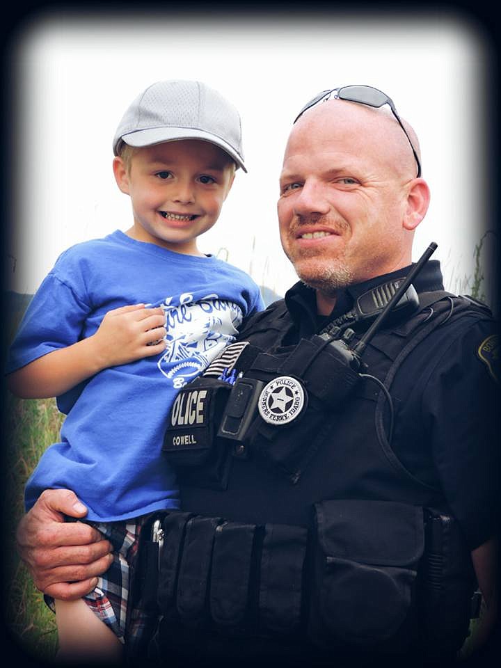 -- Courtesy photo

Ezkiel Wells with his hero and Best Local Police Officer, Willie Cowell.