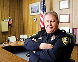 Ousted chief files suit