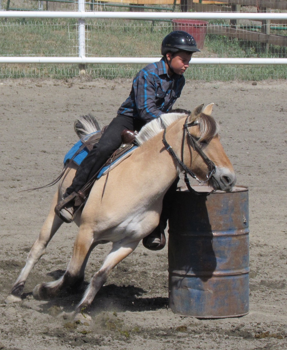 -- Photo by LYNNE HALEY

Rider and Fjord horse make a tight turn in the barrel racing event at last week&#146;s Boundary County Fair.