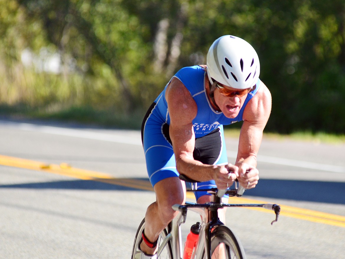 A competitor rides along Wisconsin Avenue during the biking portion of the Whitefish Lake Triathlon Sunday. Heidi Desch / Whitefish Pilot