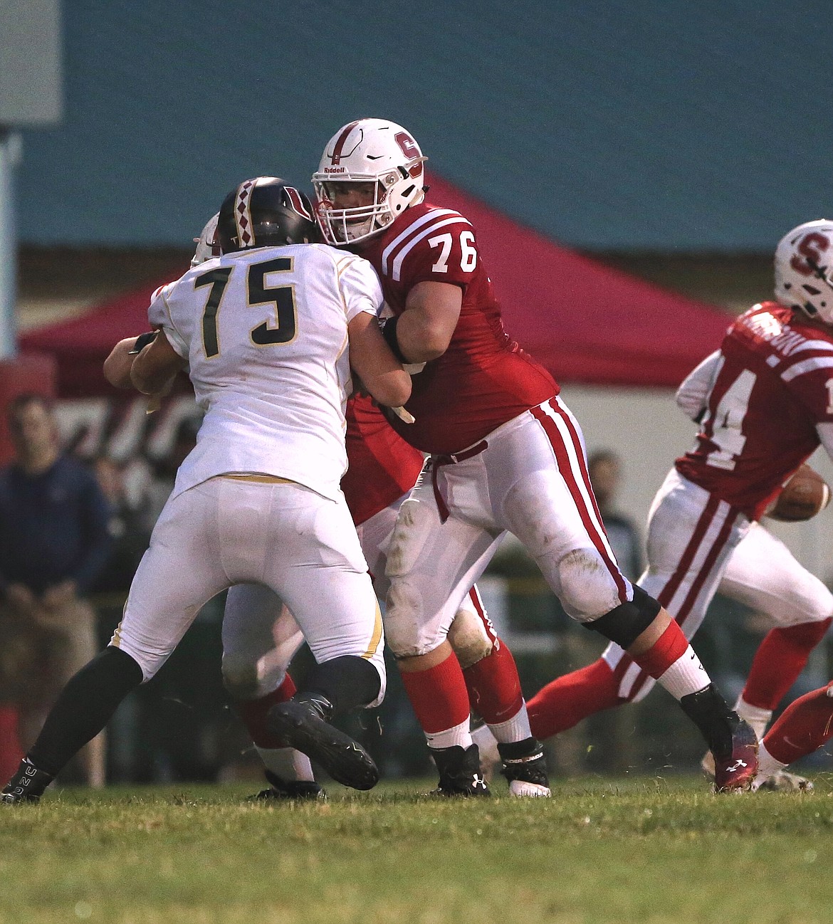 &#151;Photo by JASON DUCHOW PHOTOGRAPHY
Sandpoint junior lineman Trey Flint pass blocks during a game that will be remembered for a 90 minute lightning delay as a storm blew through Sandpoint.