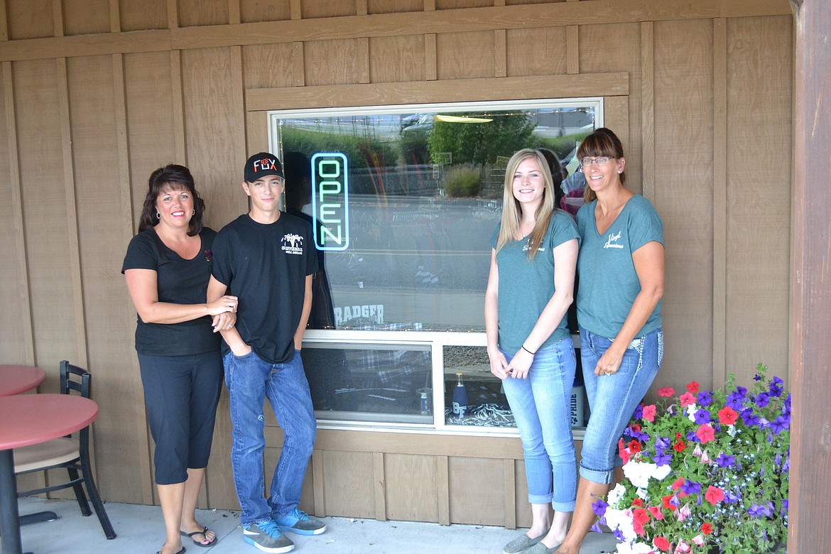 -- Photo by SARAH JENKINS

The staff at Vinyl Expressions left to right, owner, Angela Hittle, son Dylan, Kendra Merritt and Ketta Everheart.