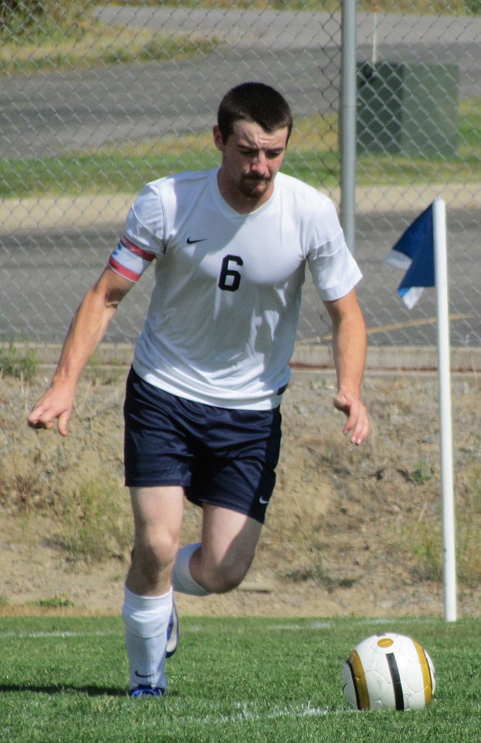 &#151; Photo by LYNNE HALEY

Badger Anthony Shutes kicks the ball back into play at Friday's soccer match.