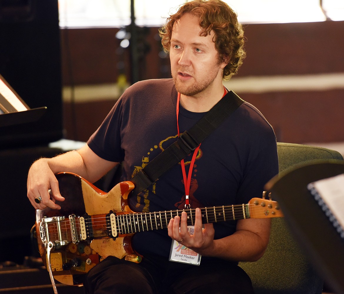 Jared Meeker talks with students in the Excel with the Masters class as they prepare to break for lunch on Monday morning, August 29, at the Seventh Annual Crown Guitar Workshop at the Flathead Lake Lodge.(Brenda Ahearn/Daily Inter Lake)