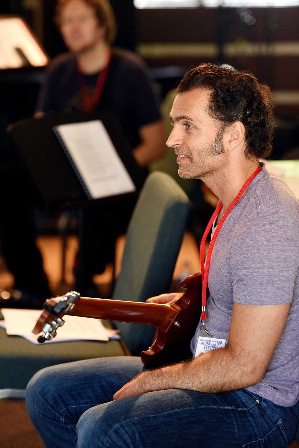 Dweezil Zappa and Jared Meeker, in the background, talk with students in the Excel with the Masters class.