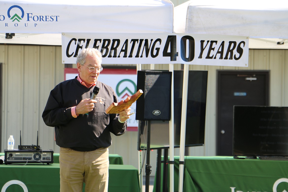 &#151;Photo by MARY MALONE
At the 40th anniversary celebration of the Laclede sawmill, Marc Brinkmeyer, Chairman of Idaho Forest Group, holds an Idaho-shaped plaque made from the first piece of wood that went through the mill in 1976.