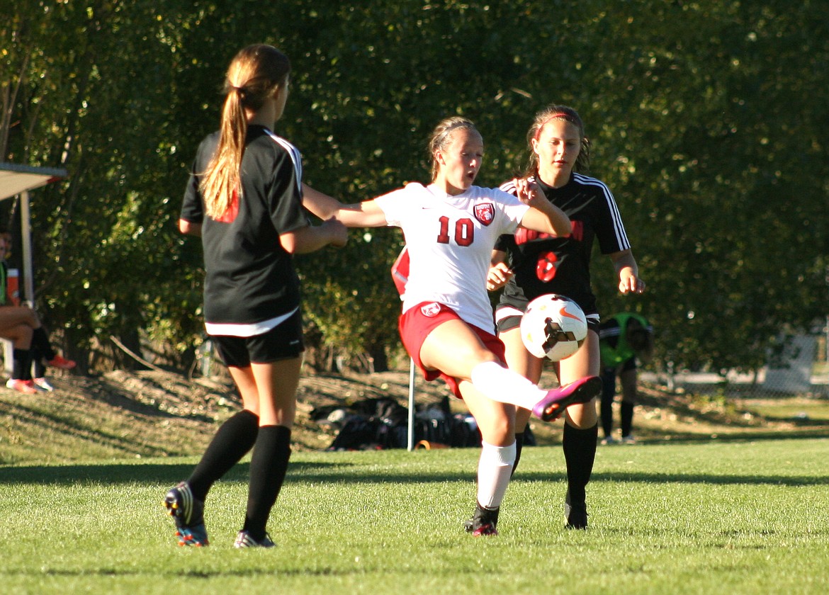 &#151;Photo by ERIC PLUMMER
Sandpoint junior Rachel Meyer volleys a ball out of the air in the Bulldogs&#146; 2-0 win on Tuesday at Pine St. Field.