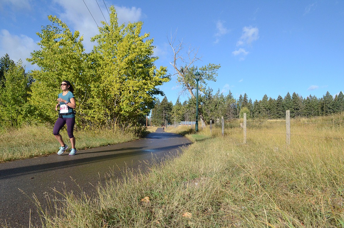 Stephanie McNabb runs along East Lakeshore Drive Sunday in the half marathon competition of the Two Bear Marathon.