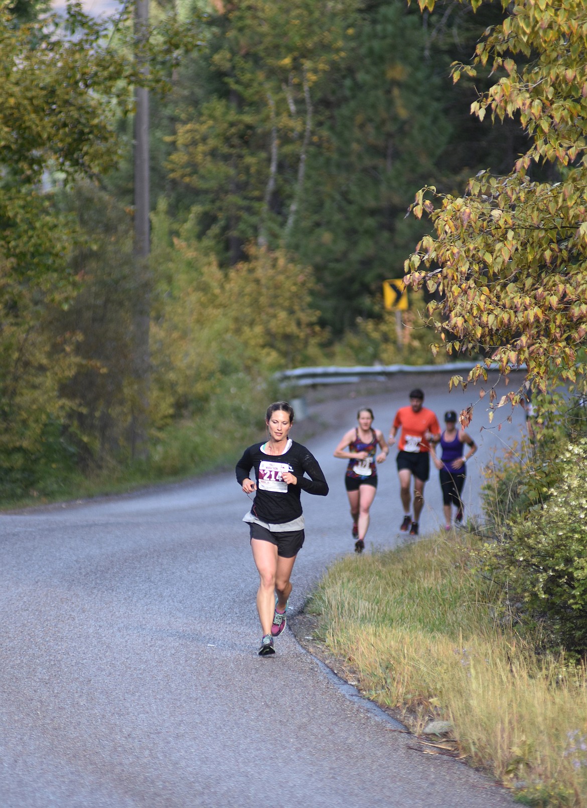 Runners make their way along East Lakeshore Drive Sunday during the half and full marathon for the Two Bear Marathon. Heidi Desch / Whitefish Pilot