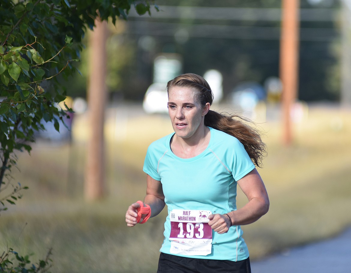 Kjersten Klass of Clancy runs along East Lakeshore Drive Sunday during the half marathon for the Two Bear Marathon. Heidi Desch / Whitefish Pilot