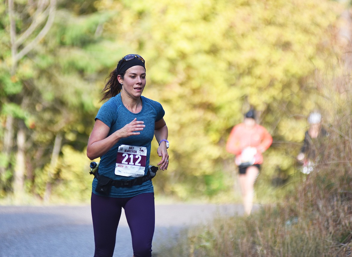 Stephanie McNabb of Lethbridge, Alberta, run along East Lakeshore during the half marathon Sunday in the Two Bear Marathon. Heidi Desch / Whitefish Pilot