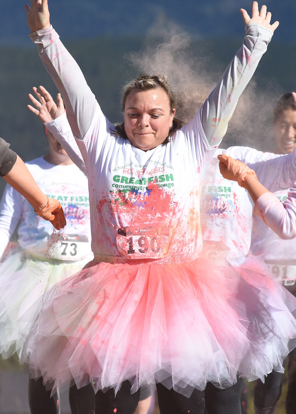 Cindy Rouse is doused with colored powder in the Great Fish Color Run on Saturday in Whitefish. The 5k run was a benefit for the Whitefish Community Foundation's Great Fish Challenge.