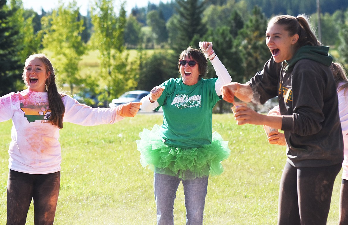 The Whitefish High School volleyball team cheers on runners in the Great Fish Color Run on Saturday in Whitefish. The 5k run was a benefit for the Whitefish Community Foundation's Great Fish Challenge.