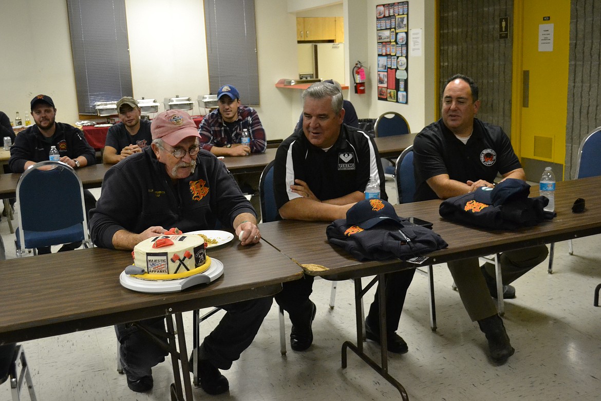 &#151;Photo by SARAH JENKINS
Chief Warkentin, Grant Grinstead of VIKING and Angel Sanchez, Jr. of Phenix Fire Helmets enjoy a conversation over dinner.