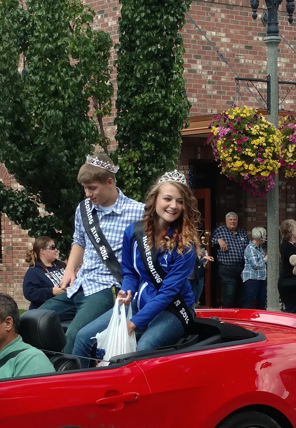 &#151;Photo by STACIE SHORT
Bonners Ferry High School seniors Kevin Gray and Lexi Levesque ride in the homecoming parade on Friday, Sept. 23, after being named homecoming king and queen.