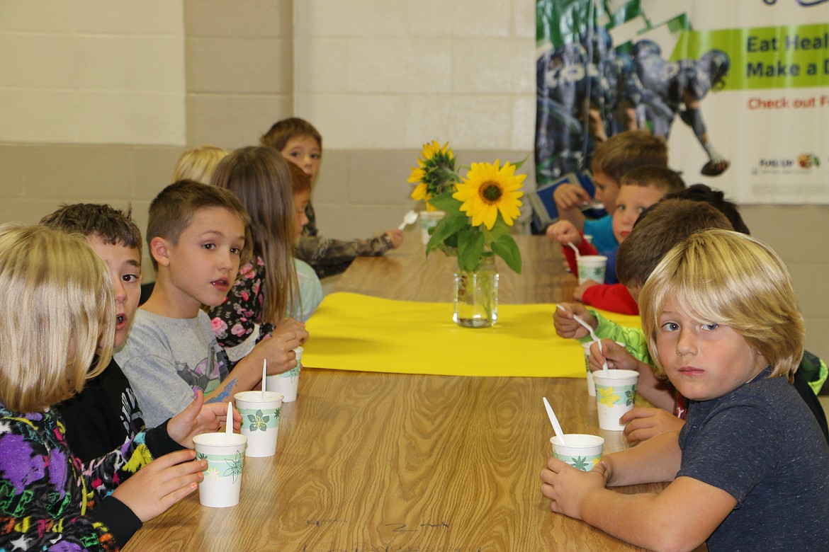 &#151; Photo by MARY MALONE
Kootenai Elementary students enjoy soup prepared with vegetables from the school garden. The fifth-graders planted the vegetables last year, harvested them last week and helped prepare and serve it Thursday.