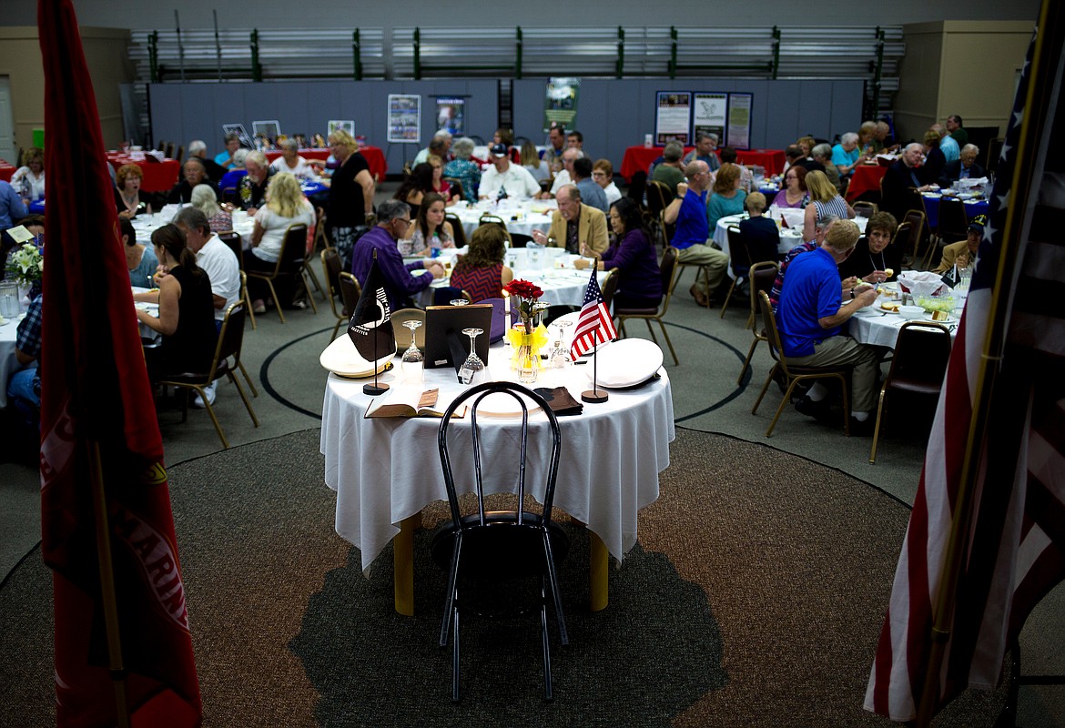 JAKE PARRISH/PressThe Fallen Comrade and Missing Man Table is formally set as about 240 people eat dinner on Friday at the National Day of Remembrance ceremony at Christ the King Lutheran Church in Coeur d'Alene.