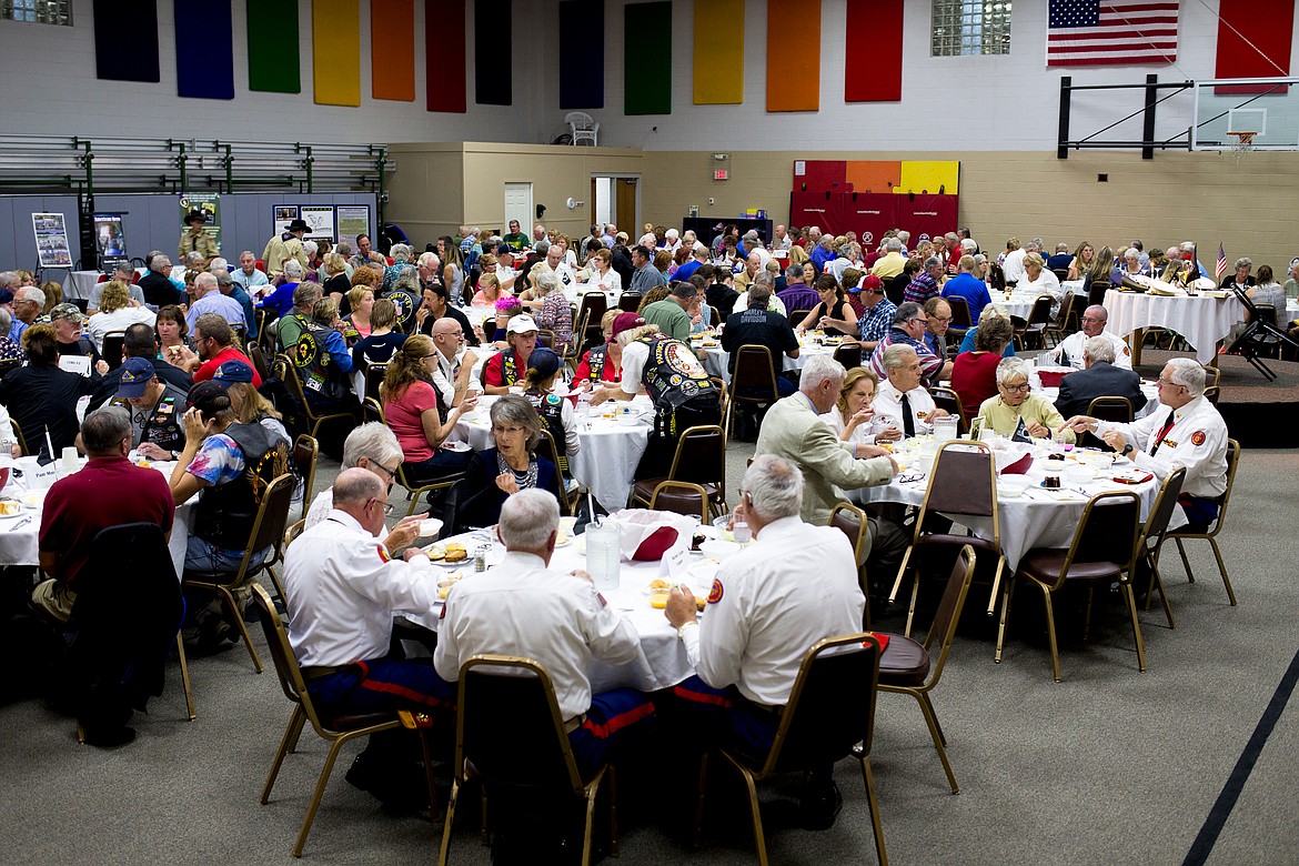 JAKE PARRISH/PressAbout 240 people eat a roast pork dinner Friday evening at the National Day of Remembrance ceremony at Christ the King Lutheran Church in Coeur d'Alene.