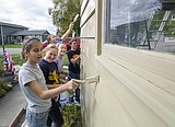 Youths lend a helping hand to homeowner with MS