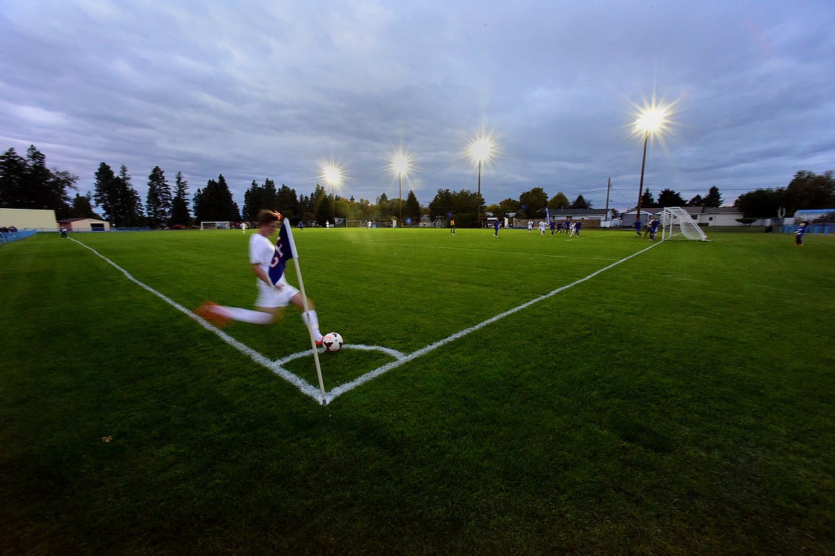 Jon Sigurdsson with a corner kick under the new lights at Flip Darling Field.