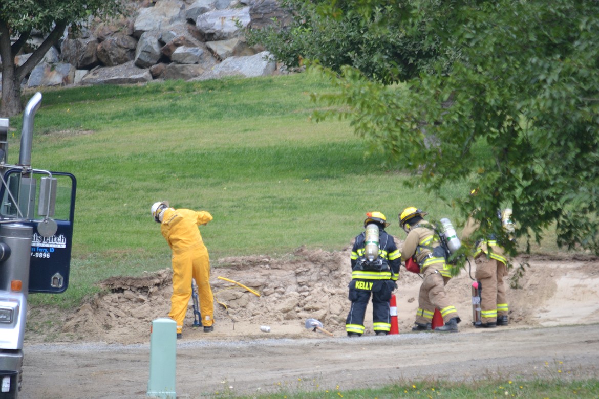 -- Photo by SARAH JENKINS

Brian Scimsher of Avista turns off the natural gas with BFFD in close proximity.