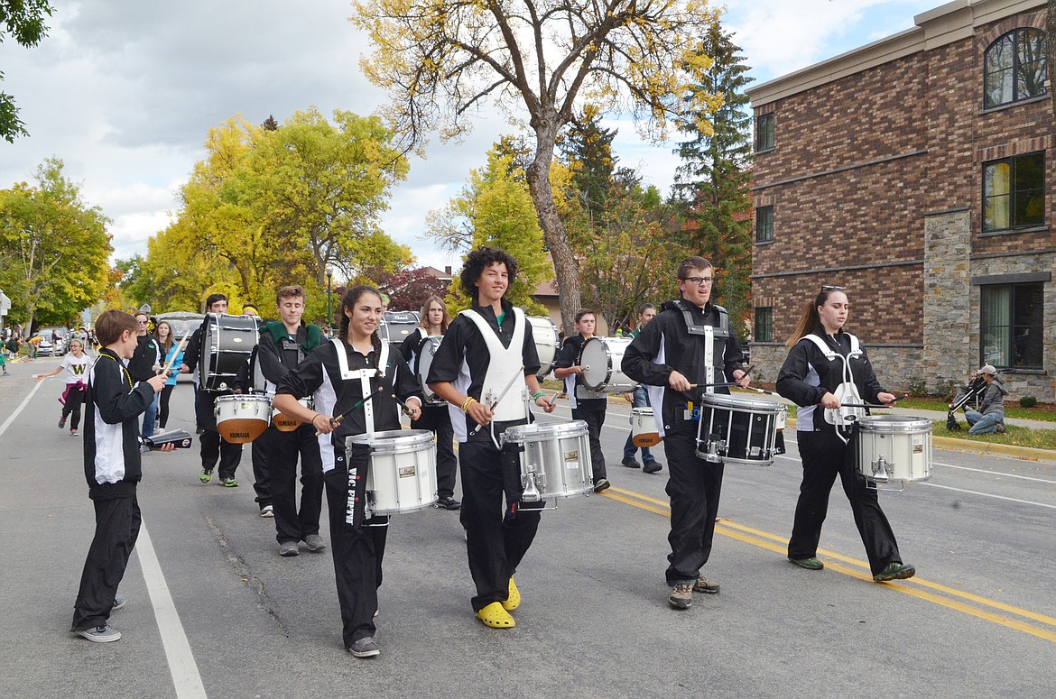 The Whitefish High School Drumline marches down Second Street Friday during the Homecoming parade.