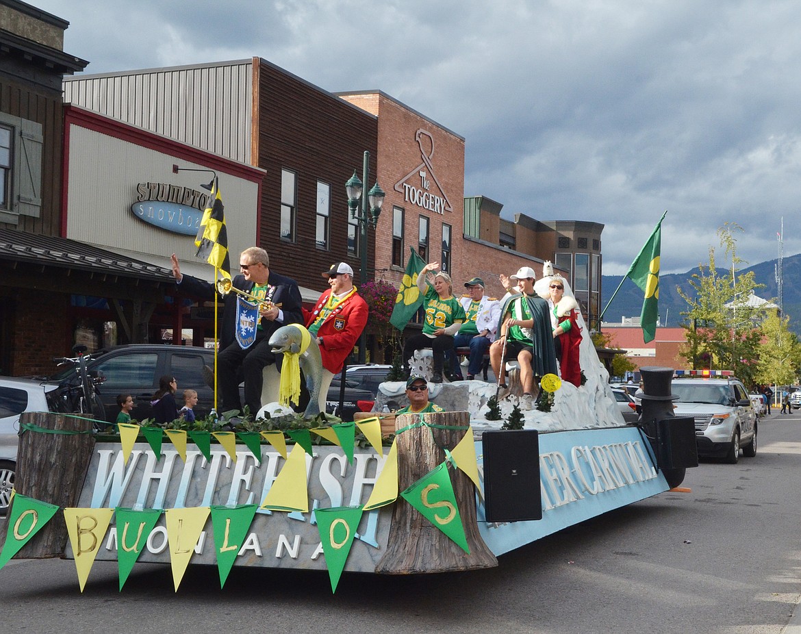 The Whitefish Winter Carnival royalty rides down Central Avenue Friday during the Homecoming parade.