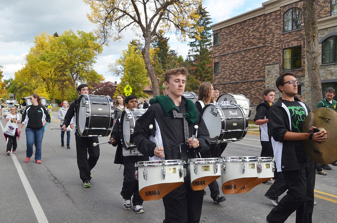 The Whitefish High School Drumline marches down Second Street Friday during the   Homecoming parade.