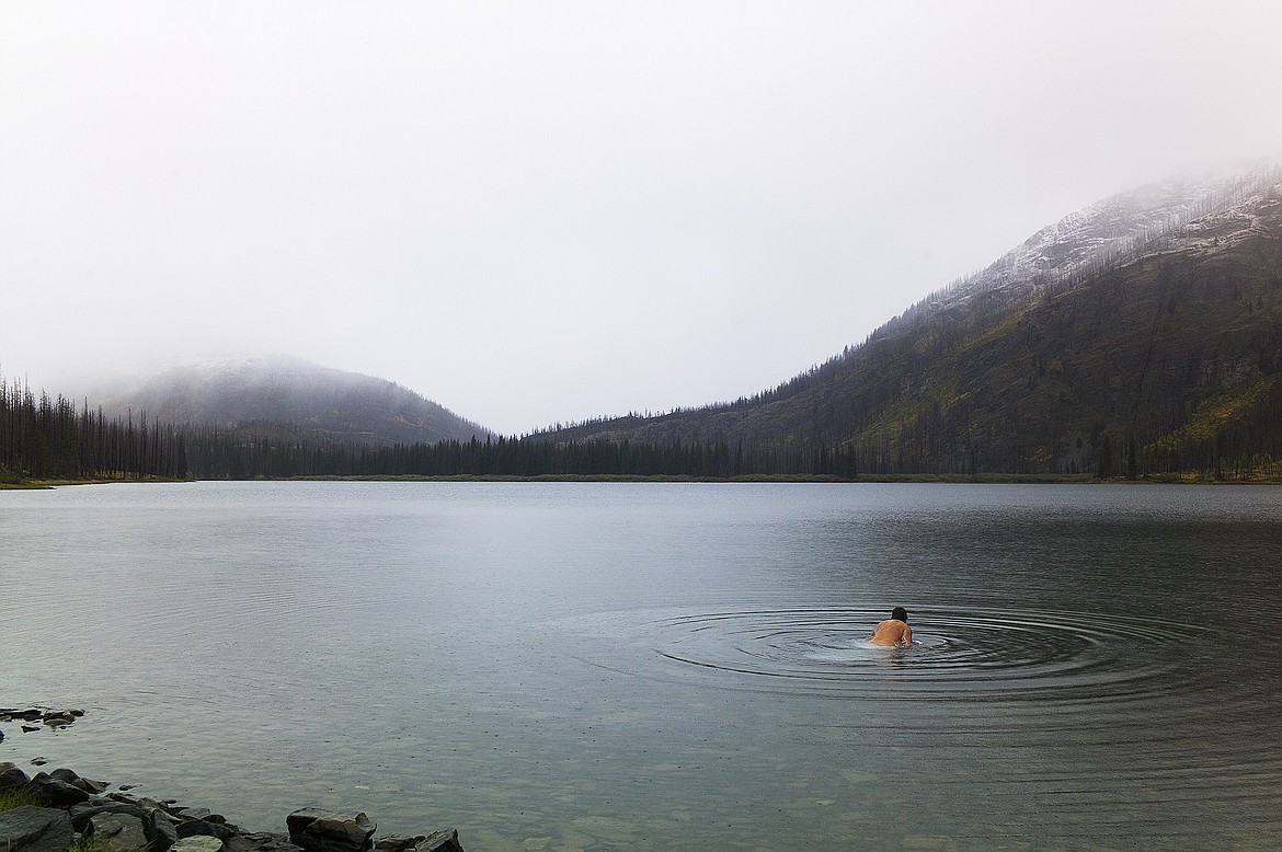 Taking a swim as it snows over Red Eagle Lake.