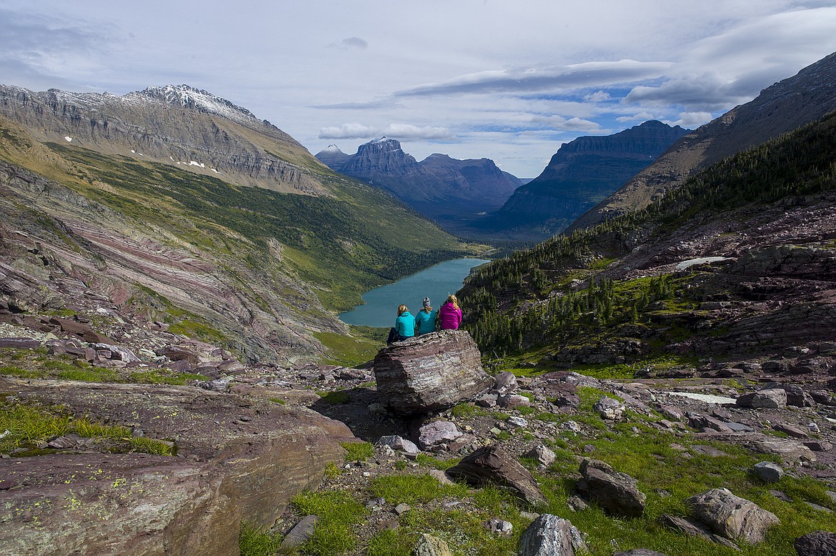 Three sisters from Kalispell take in the views from Gunsight Pass.