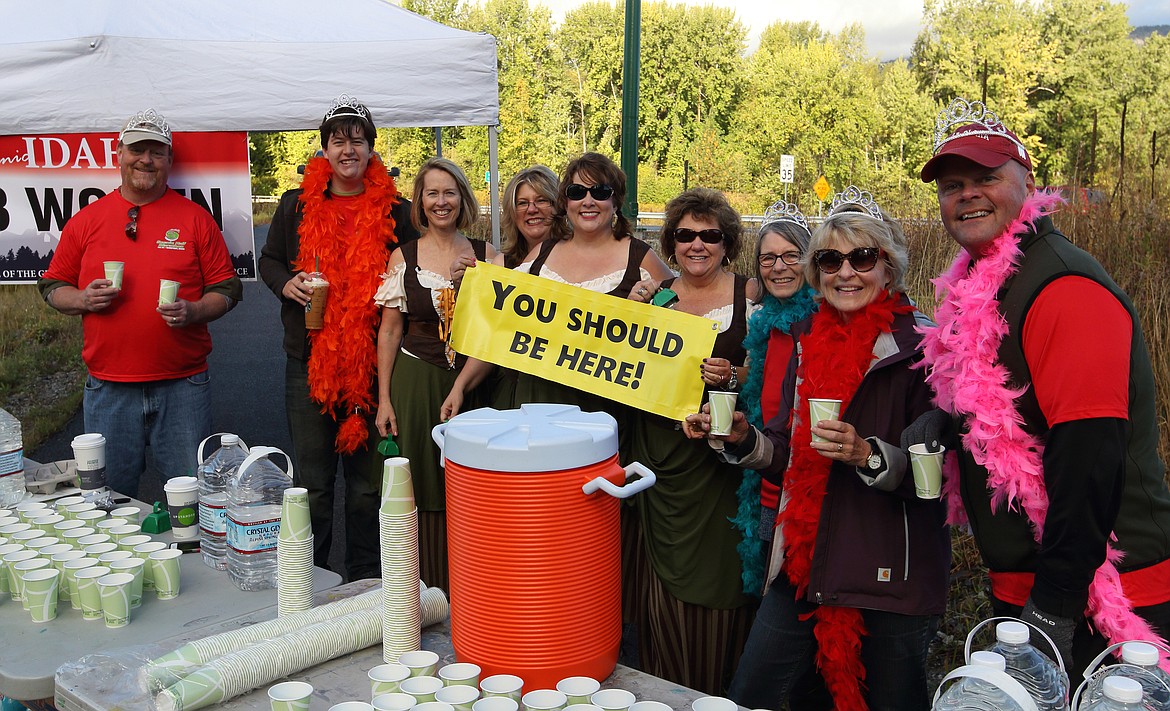 &#151;Photo by JIM McKIERNAN
The 7B Women staff one of the stops near the end of the 5K course to highlight their upcoming race, Boobs and Beer, to benefit local cancer charities.