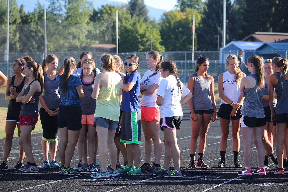 &#151;Photo by JUDD WILSON/HAGADONE NEWS NETWORK
Bonners Ferry cross country team members join competitors as they wait for the start of a recent cross country event.