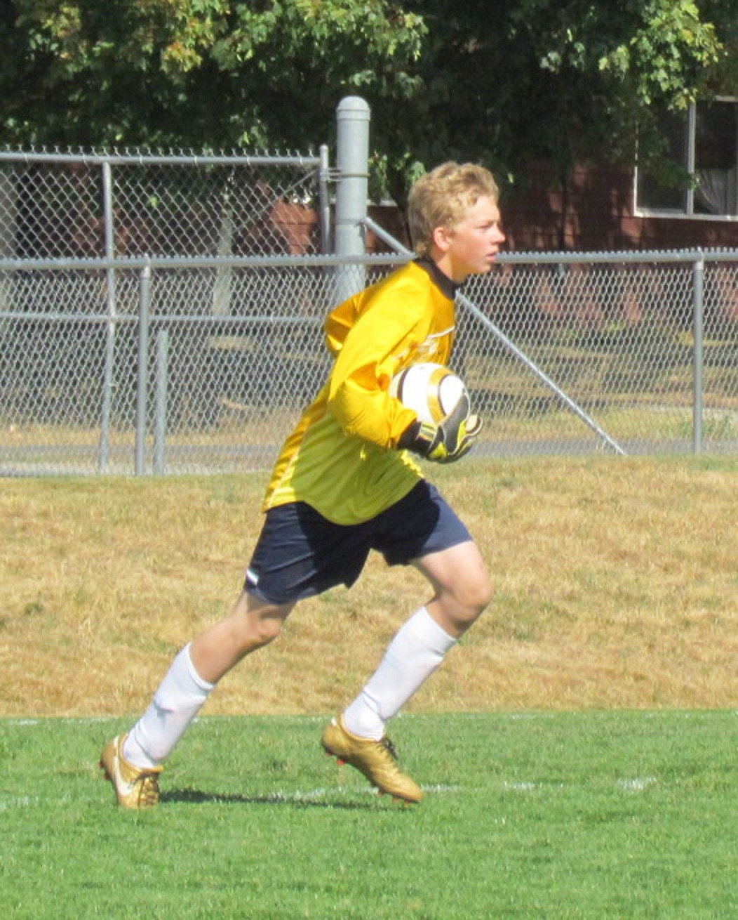 &#151;BONNERS FERRY HERALD FILE PHOTO
The Badger goalie scoops up a failed goal attempt at a recent game with Stillwater Christian.