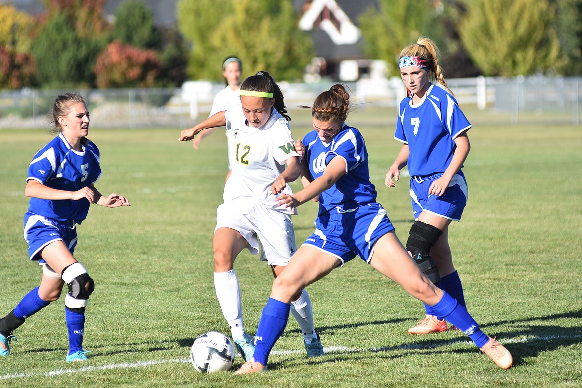 Daniel McKay / Whitefish Pilot
Freshman Anna Cook dribbles through Columbia Falls defenders in Thursday&#146;s 3-2 win at Smith Fields.