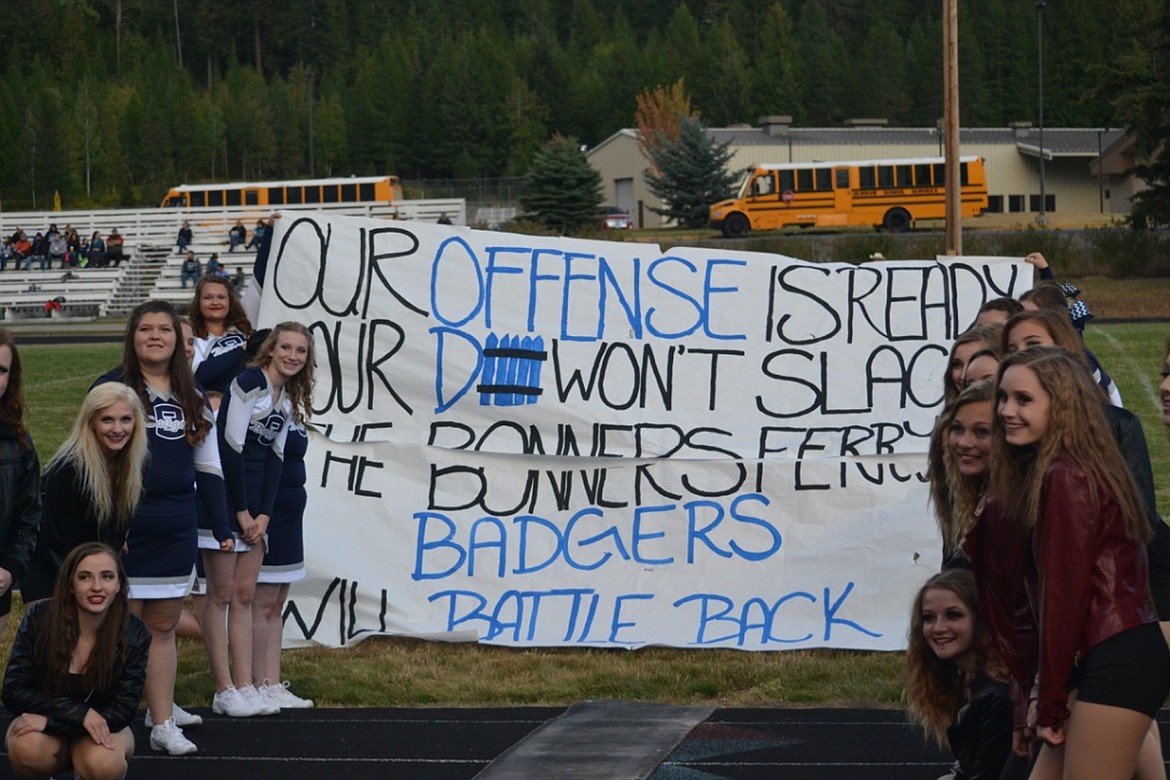 &#151;Photo by SARAH JENKINS
The Badgerettes and cheerleaders cheer on the varsity boys during their first home game.