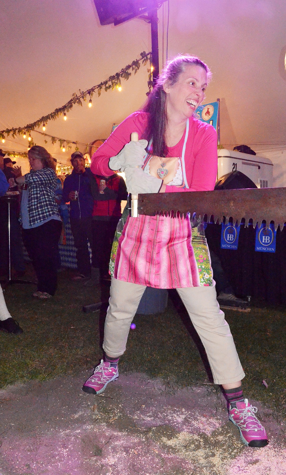 A competitor gets ready to saw during the women&#146;s log sawing competition Thursday evening at the Great Northwest Oktoberfest at Depot Park.