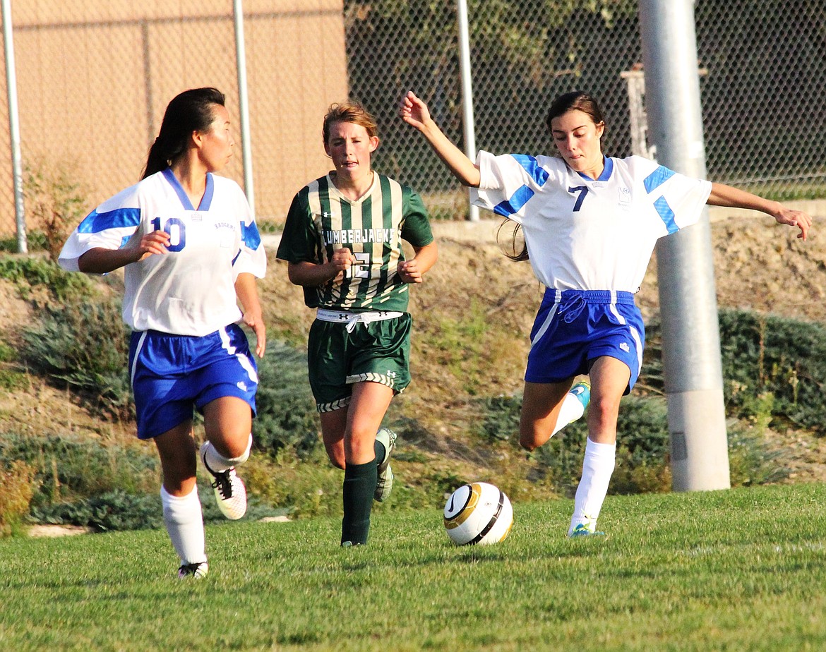 &#151;Courtesy photo
Senior Grace Coughlin, left, looks back for a pass from sophomore Falisha Elliston in the Badgers 4-1 home victory over St. Maries recently. The girls host Lakeland tonight at 4 p.m. In boys soccer, Ethan Wilson tallied two goals, and Dakota Neilsen and Pacen Pluid one each in a 5-0 win over Priest River, and Wilson, Elijah Price and Pluid each scored in a 3-0 win over Orofino. Seth Bateman picked up the shutouts in goal for both games. The Badger boys host 4A Lakeland tonight in a home doubleheader.