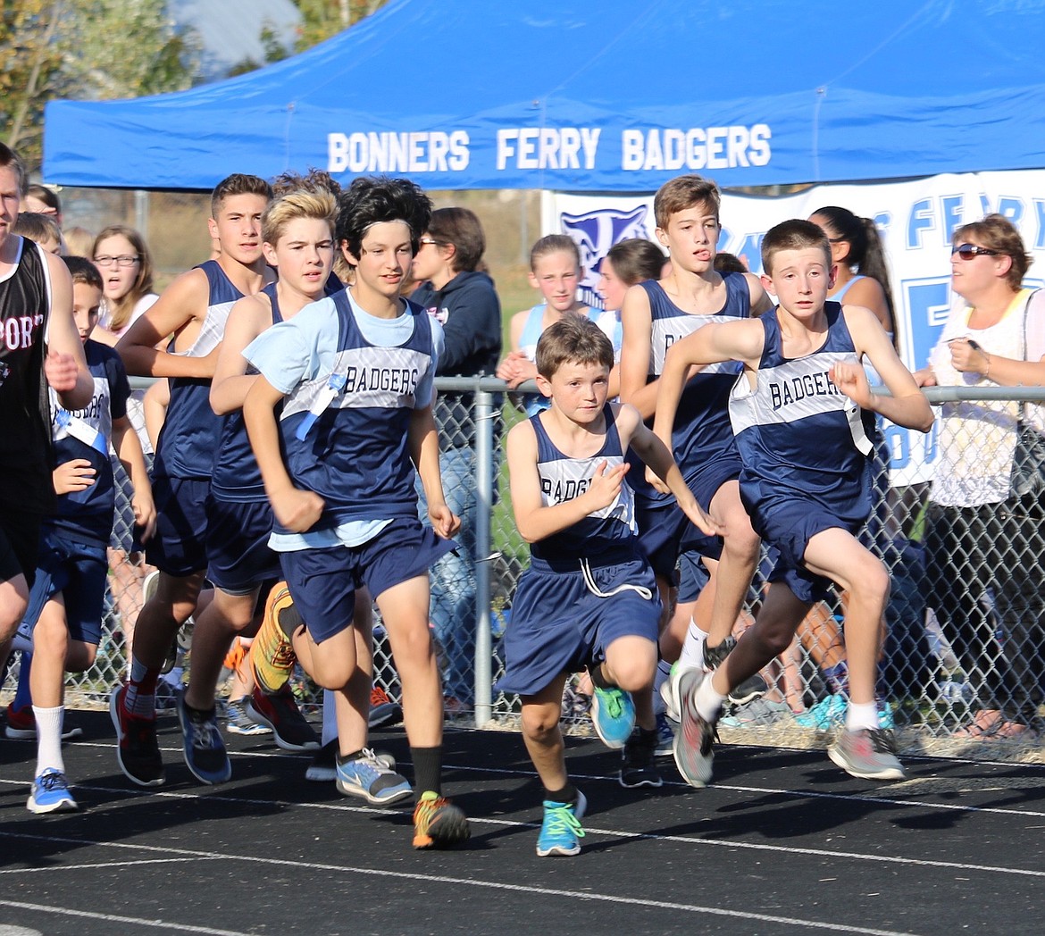 &#151;Photo by JUDD WILSON/TIMES
The Badgers middle school cross country teams both claimed championships at the recent Ivan Benson Invitational in Priest River. Sky Reinhardt (first), Tulley Reinhardt (second) and Nolan Smith (fourth) led the boys, while Sophia Roemer (second) and Geneva Bontrager (fourth) led the girls. In the varsity girls race, Jordan Young (second), Abigail Gorton (third) and Ada Bonnell (eighth) notched top ten finishes for a second place finish. In the varsity boys race, Eric Ellis (ninth), Dawson Thomas (10th) and Austin Donn (11th) led the Badgers to a fourth place finish among six teams. The Badgers are at the Sandpoint Invitational on Saturday.