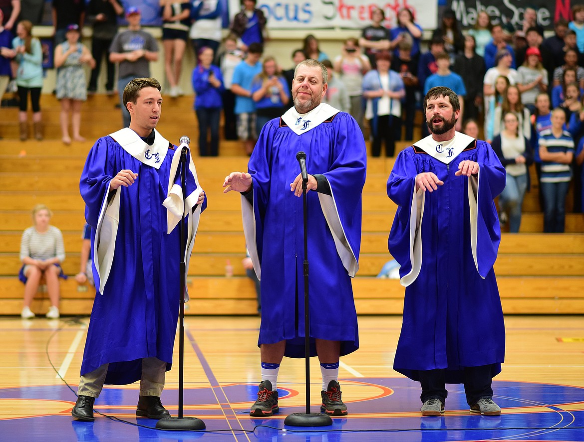 Teachers Jake Hall, Jackson Schweikert and Josh Forke perform during the Columbia Falls High School pep rally last week. They were the &#147;chorus&#148; as principal Scott Gaiser lip synced &#147;Ain&#146;t No Mountain High Enough.&#148;