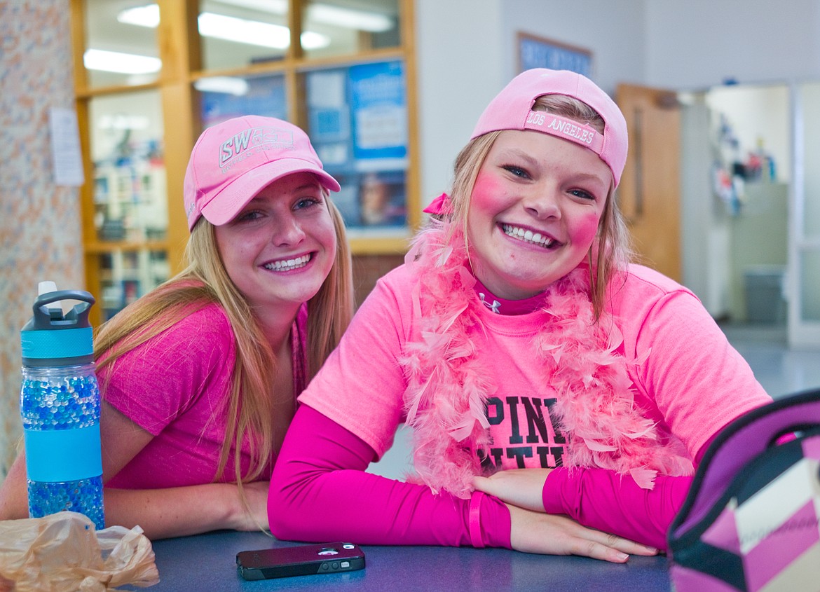 Savannah Ellis, left, and Trista Cowan were decked out in pink for colors day at Columbia Falls High School as part of homecoming week.