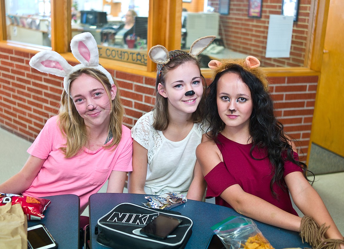 From left, Alex Peters, Sadie Jones and Emily West got decked out for &#147;animals&#148; day at Columbia Falls High School for homecoming week Wednesday.